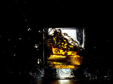 Adding ice to bourbon does more than just chill it; it dilutes the spirit as the ice melts.